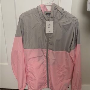 Pink and grey light windbreaker with tags. Size M
